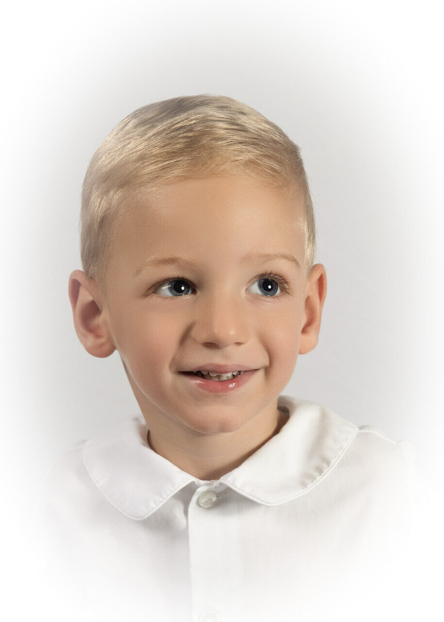 Classic heirloom portrait of a smiling young boy